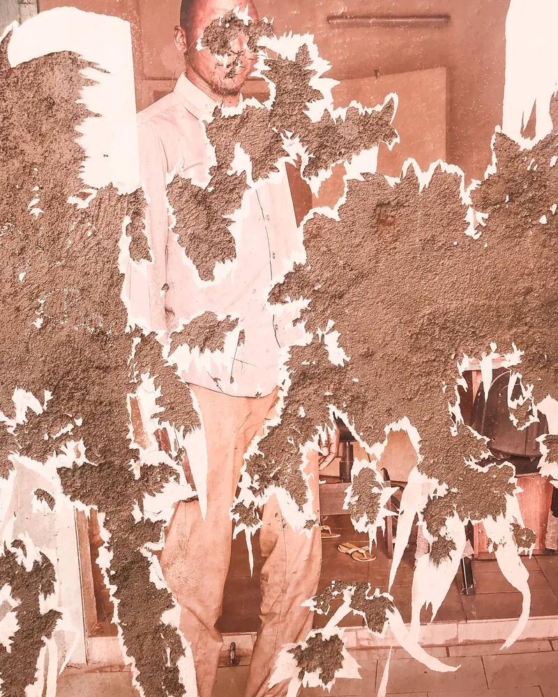 A water-damaged old photo, before restoration